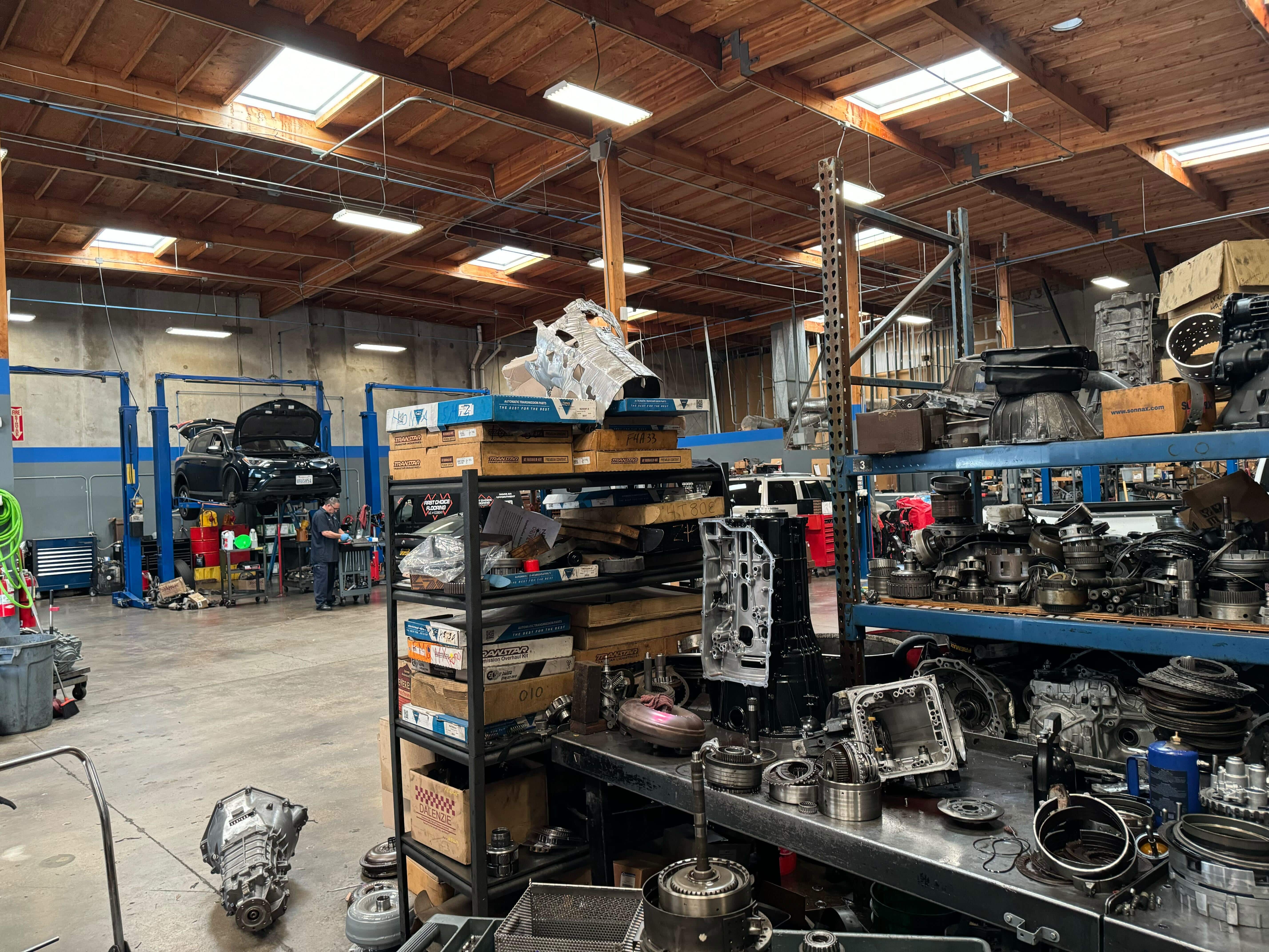 Transmission rebuild workbench and heavy-duty lifts in the Miramar shop